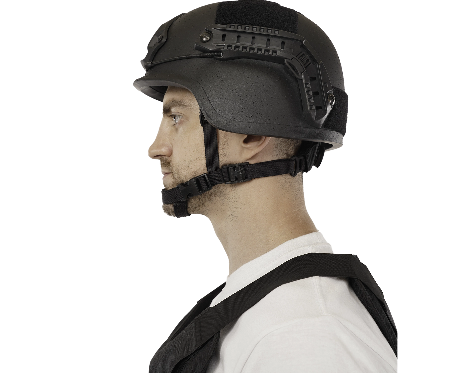 Side view of a person wearing a tactical helmet fitted with Picatinny quick-release rail adapters and a chin strap.