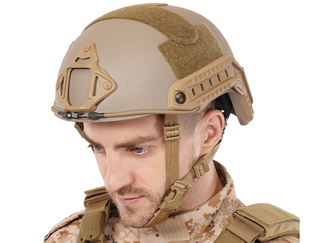 Soldier wearing tan Special Force tactical helmet with side rails and NVG mount, paired with camouflage uniform and tactical vest.