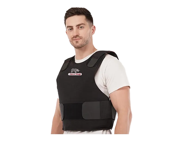 Man wearing a black Hard Shell concealable vest - low pro for personal protection and concealed body armor safety